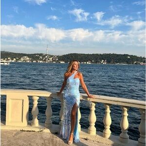 Beautiful blue gown for a special occasion . Wore one time , size 4.